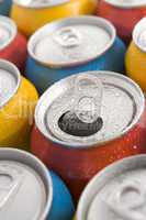 Close Up Of Multi Colored Soda Cans With One Open
