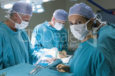 Four Surgeons Getting Ready To Operating On A Patient