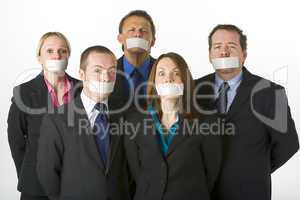 Group Of Business People With Their Mouths Taped Shut