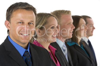 Group Of Business People In A Line Smiling