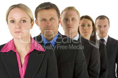 Group Of Business People In A Line Looking Serious