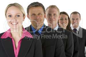 Group Of Business People In A Line Smiling