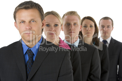 Group Of Business People In A Line Looking Serious