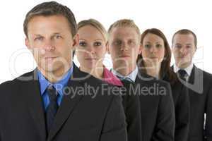 Group Of Business People In A Line Looking Serious