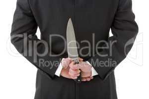 Businessman Holding Knife Behind His Back