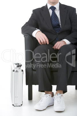 Businessman Sitting Wearing Sneakers