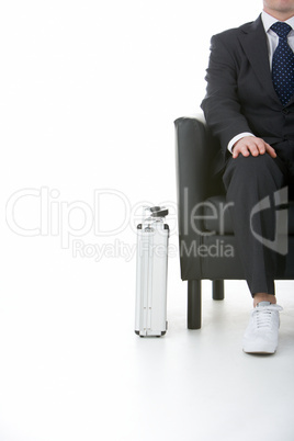 Businessman Sitting Wearing Sneakers