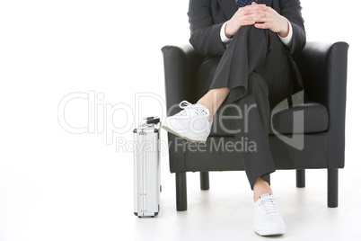 Businessman Sitting Wearing Sneakers