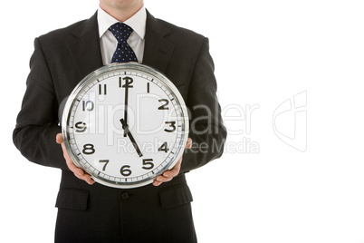 Businessman Holding Clock