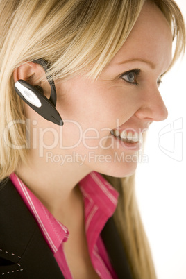 Businesswoman Talking On Hands Free Phone