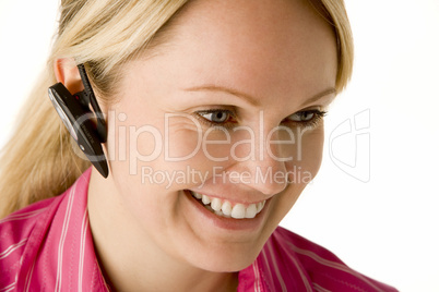 Businesswoman Talking On Hands Free Phone