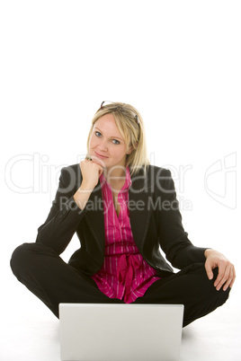 Businesswoman Sitting In Front Of Laptop Thinking