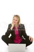 Businesswoman Sitting In Front Of Laptop Thinking