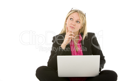 Businesswoman Sitting In Front Of Laptop Thinking