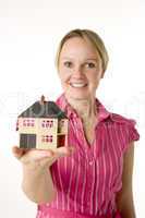 Businesswoman Holding Small House