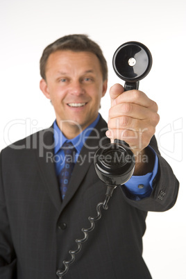 Businessman Holding Telephone