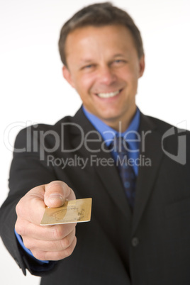 Businessman Handing Over Gold Credit Card