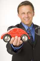 Businessman Holding A Toy Car