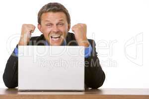 Businessman Cheering At Laptop
