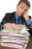 Businessman Overwhelmed By Paperwork