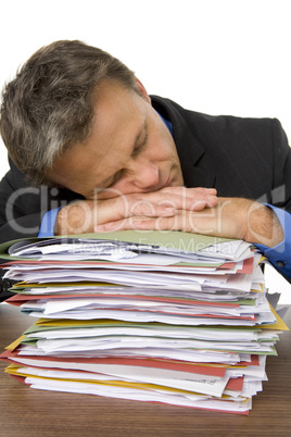 Businessman Overwhelmed By Paperwork