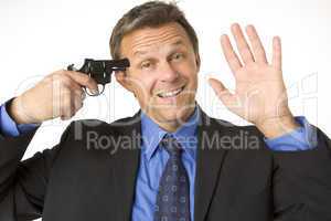 Businessman Holding Gun To His Head While Smiling And Waving