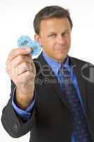 Businessman Holding Poker Chips To The Value Of $2000