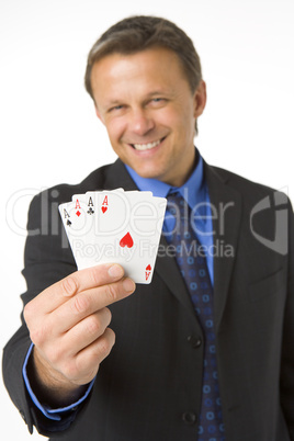 Businessman Holding Four Aces