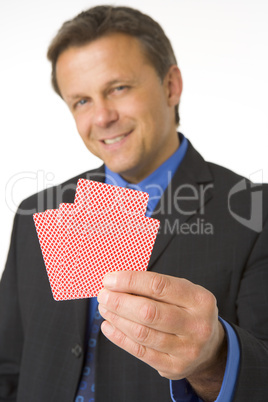Businessman Holding Playing Cards