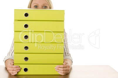 Businesswoman With Stack Of Folders