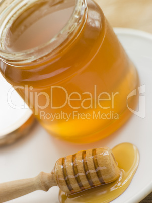 Jar Of Honey And Spoon