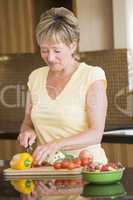 Woman Cutting Up Vegetables