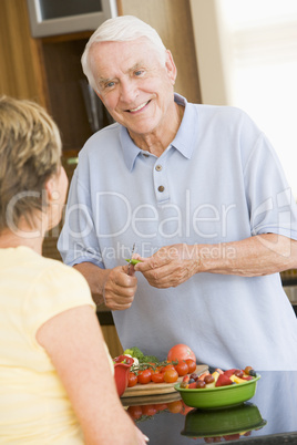 Husband And Wife Preparing Vegetables