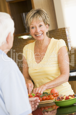 Husband And Wife Preparing Vegetables