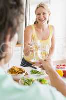 Woman Talking To Husband While Preparing meal,mealtime