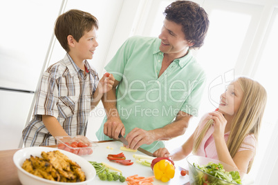 Father And Children Prepare A meal,mealtime Together