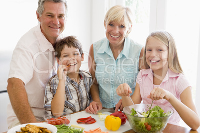 Grandparents And Grandchildren Prepare A meal,mealtime Together