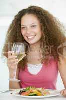 Woman Eating meal,mealtime With A Glass Of Wine