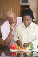 Husband And Wife Preparing A meal,mealtime Together