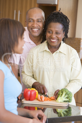 Couple With Daughter Preparing meal,mealtime