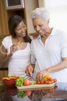 Mother And Daughter Preparing A meal,mealtime Together