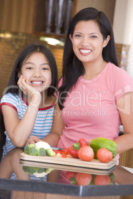 Mother And Daughter Preparing meal,mealtime Together