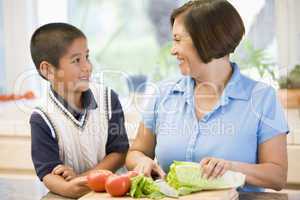 Grandmother And Grandson Preparing meal,mealtime Together