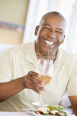 Man Enjoying meal,mealtime With A Glass Of Wine