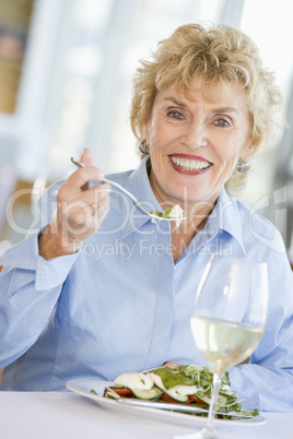 Woman Enjoying meal,mealtime With A Glass Of Wine