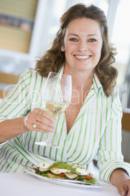 Woman Enjoying meal,mealtime With A Glass Of Wine