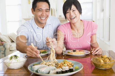 Young Couple Enjoying Chinese Food