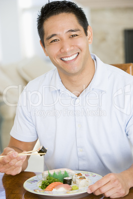 Man Enjoying Chinese Food With Chopsticks