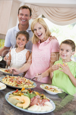 Mother Serving Up Dinner For Family