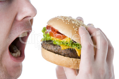 Man About To Bite Into A Cheeseburger